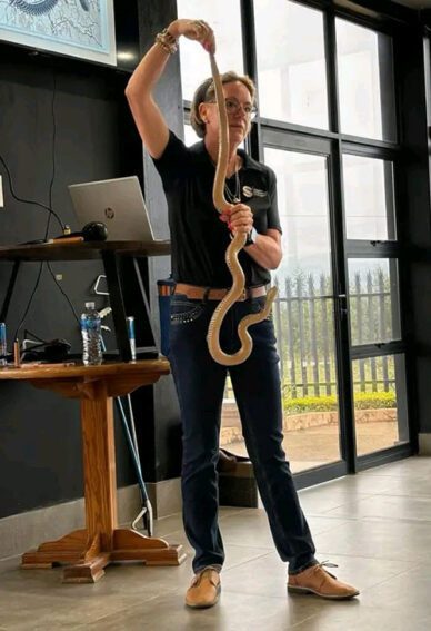 Litschka-Koen holding a snake.