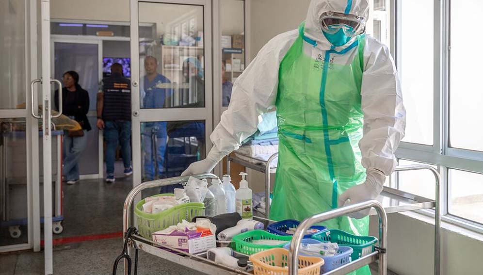 © WHO/Ardo Farah A healthcare worker in Kenya prepares Ebola response materials as part of a training exercise.