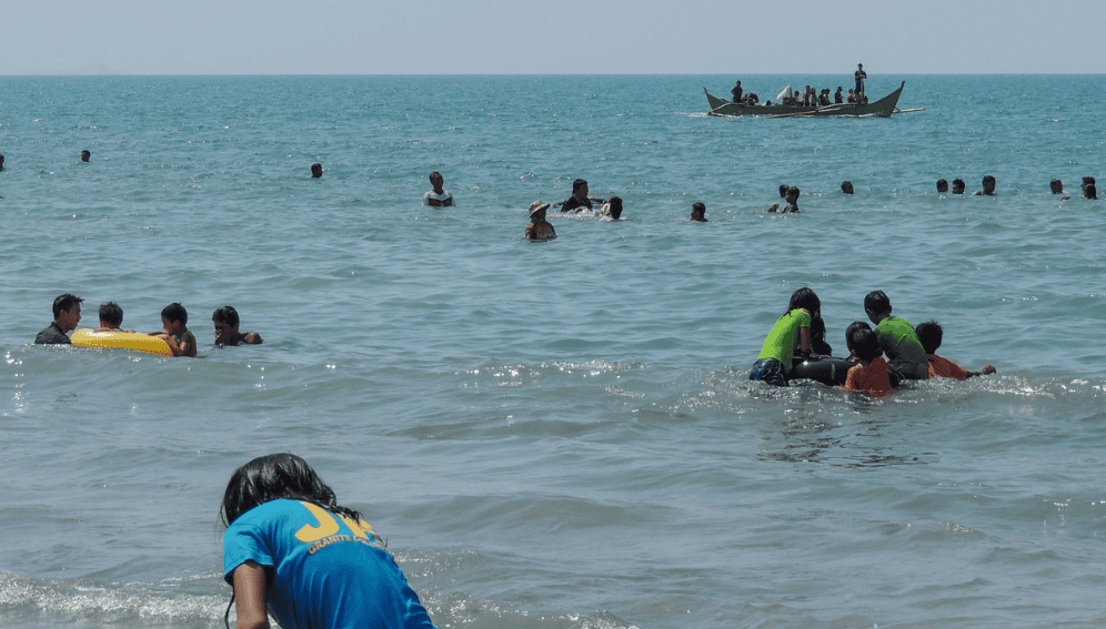 Many families in the Philippines, seek some relief from the oppressive heat by heading to the beach.