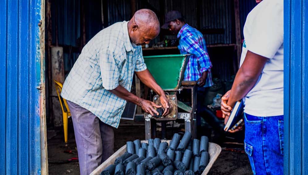 Refugees at Kyaka II refugee settlement camp produce several tonnes of eco-friendly cooking briquettes from scraps such as maize cobs, banana peels, and sawdust.